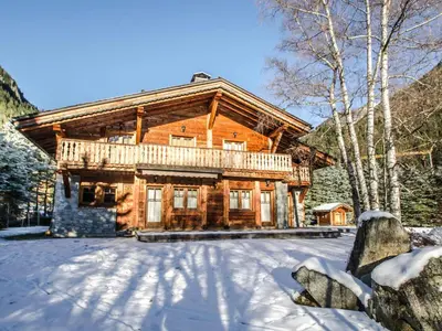 a log cabin in the winter with snow on the ground at Chalet de charme à Chamonix avec WiFi et parking privé pour 12 pers. - FR-1-343-226 in Chamonix-Mont-Blanc