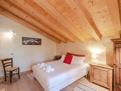 a bedroom with a bed and a wooden ceiling at Chalet de charme à Chamonix avec WiFi et parking privé pour 12 pers. - FR-1-343-226 in Chamonix-Mont-Blanc