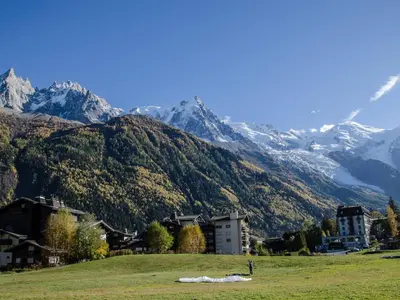 a mountain range with a town and buildings in a field at Studio cosy 3 pers, ski-in/ski-out Chamonix avec wifi et animaux admis - FR-1-343-217 in Chamonix-Mont-Blanc