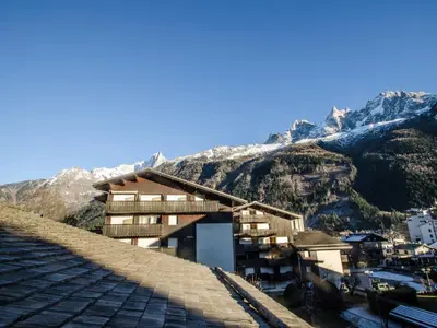 a building on top of a mountain with snow at Studio cosy 3 pers, ski-in/ski-out Chamonix avec wifi et animaux admis - FR-1-343-217 in Chamonix-Mont-Blanc