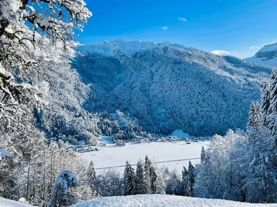 a view of a snow covered valley with a mountain at Le Chalet de Bémont in Samoëns