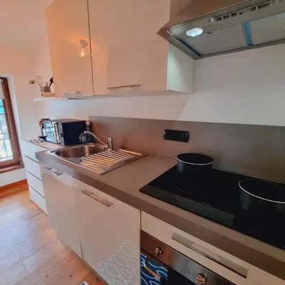 a kitchen with a sink and a counter top at ALPES IV - Hyper Centre - Parking - 40m² in Chamonix-Mont-Blanc