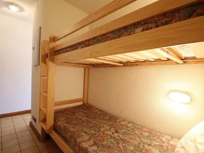 a bedroom with two bunk beds in a room at Studio spacieux 5 pers avec parking aux Carroz d'Arâches - FR-1-572-192 in Arâches-la-Frasse