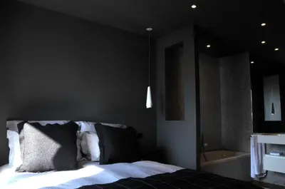 a bedroom with a bed and a bath tub at Chamonix Bellevue in Chamonix-Mont-Blanc