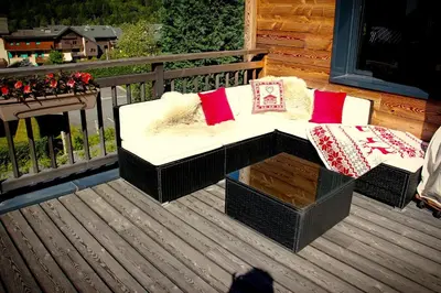 a bench in a room with a brick wall at Chalet Amour blanc Chamonix Les Houches in Les Houches
