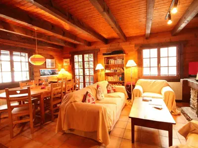 a living room with a couch and a table at Chalet 4 chambres sur pistes débutants avec balcon et parking, à 350m des commerces - FR-1-572-196 in Arâches-la-Frasse