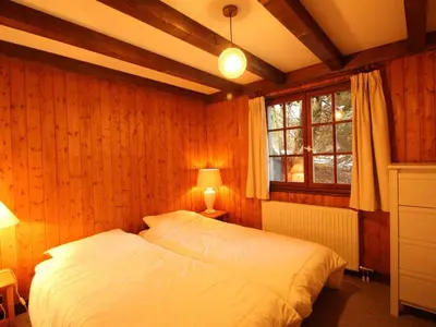 a bedroom with a white bed and a window at Chalet 4 chambres sur pistes débutants avec balcon et parking, à 350m des commerces - FR-1-572-196 in Arâches-la-Frasse