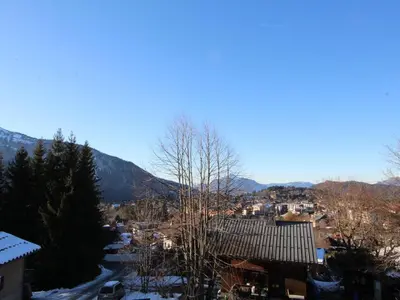 a town in the snow with mountains in the background at Appartement Rénové 6/8 Pers, Pied des Pistes, Balcon, Garage, WiFi - Arâches-la-Frasse - FR-1-572-139 in Arâches-la-Frasse