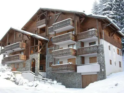 a building with balconies on it in the snow at Appartement Rénové 6/8 Pers, Pied des Pistes, Balcon, Garage, WiFi - Arâches-la-Frasse - FR-1-572-139 in Arâches-la-Frasse