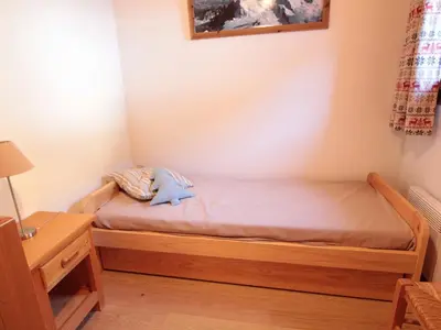 a bedroom with a bed with a stuffed animal on it at Appartement Rénové 6/8 Pers, Pied des Pistes, Balcon, Garage, WiFi - Arâches-la-Frasse - FR-1-572-139 in Arâches-la-Frasse