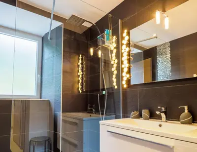 a bathroom with a sink and a mirror at DIFY Clos des Roches - Chamonix in Chamonix-Mont-Blanc