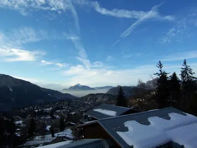 a view of a city in the mountains with snow at Studio 4 pers avec lave-linge, pied des pistes et parking couvert à Arâches-la-Frasse - FR-1-572-266 in Arâches-la-Frasse