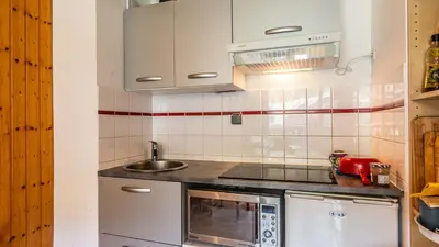a kitchen with a sink and a microwave at Les Sitelles - 18 - Belle vue Appart 6 pers in Morillon