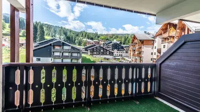 a balcony with a view of the mountains at Les Sitelles - 18 - Belle vue Appart 6 pers in Morillon