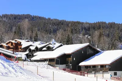 a group of buildings covered in snow at Grand Morillon - 104 - Montagne Belle Vue Studio 4 in Morillon