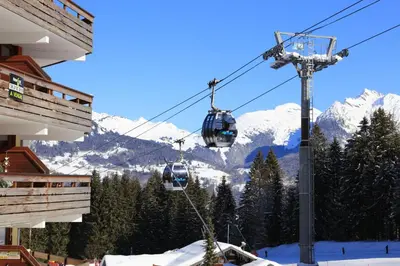 a ski lift in the mountains with snow at Le Grand Neige - 36 - Appart Montagne 6 pers in Morillon