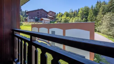 a view from a balcony of a house at Le Grand Neige - 36 - Appart Montagne 6 pers in Morillon
