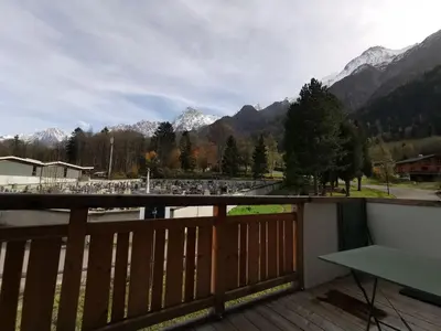 a balcony with a view of the mountains at Terra Losa - Tout Nouveau - Centre des Houches - Point de Départ et D'arrivée TMB in Les Houches