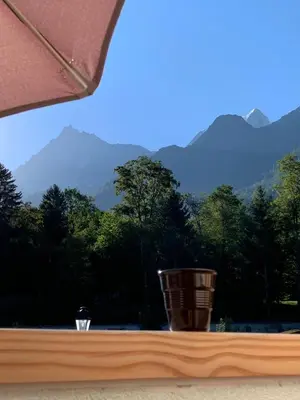 a window with a view of a mountain range at Terra Losa - Tout Nouveau - Centre des Houches - Point de Départ et D'arrivée TMB in Les Houches