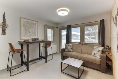 a living room with a couch and a table at Perce-Neige - Centre Chamonix in Chamonix-Mont-Blanc
