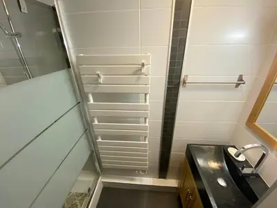 a large apartment building with cars parked in front of it at Appartement cosy à Morillon - 6 pers, internet - FR-1-815-90 in Morillon