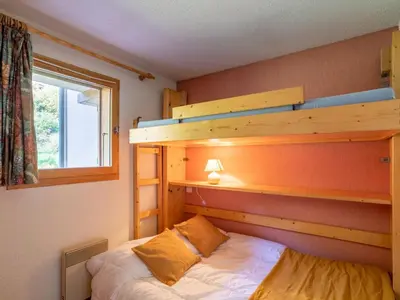 a bedroom with a bunk bed and a window at Apartment Aiguilles du Midi by Interhome in Saint-Gervais-les-Bains