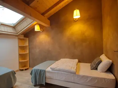 a bedroom with a bed and a window at Appartement calme 2 chambres avec terrasse à Samoëns - FR-1-642-77 in Samoëns