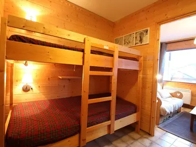 a bedroom with two bunk beds in a cabin at Studio 4 pers. avec Balcon, Proche Pistes et Commerces, Parking Inclus - Arâches-la-Frasse - FR-1-572-181 in Arâches-la-Frasse