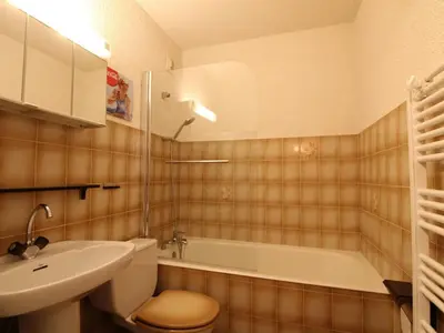 a bathroom with a sink and a toilet and a tub at Studio 4 pers. avec Balcon, Proche Pistes et Commerces, Parking Inclus - Arâches-la-Frasse - FR-1-572-181 in Arâches-la-Frasse
