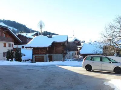 a white car parked in front of a building with snow at Studio 4 pers. avec Balcon, Proche Pistes et Commerces, Parking Inclus - Arâches-la-Frasse - FR-1-572-181 in Arâches-la-Frasse