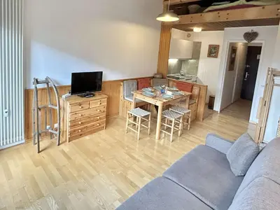 a living room with a couch and a table at Studio + Alcôve 4 Couchages, Balcon, Parking, Skis - Proche Rochebrune, Megève - FR-1-597-168 in Megève
