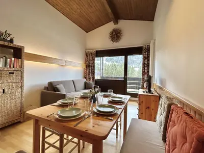 a dining room with a table and a couch at Studio + Alcôve 4 Couchages, Balcon, Parking, Skis - Proche Rochebrune, Megève - FR-1-597-168 in Megève