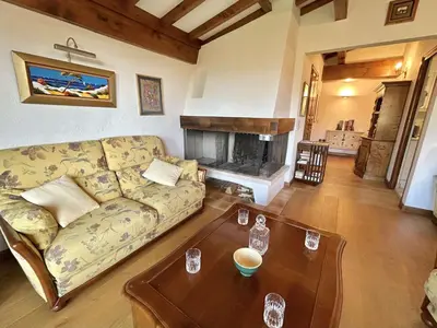 a living room with a couch and a fireplace at Charmant 2 pièces, 4 couchages, Megève - À 400m des remontées mécaniques, balcon et parking inclus - FR-1-597-169 in Megève