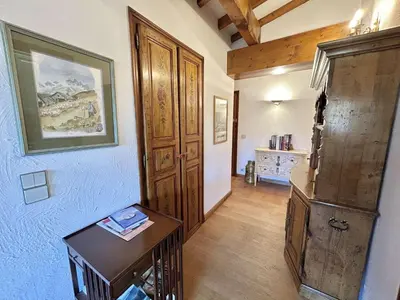 a room with a wooden door and a table at Charmant 2 pièces, 4 couchages, Megève - À 400m des remontées mécaniques, balcon et parking inclus - FR-1-597-169 in Megève