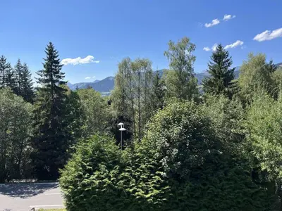 a forest of trees with a cross in the middle at Charmant 2 pièces, 4 couchages, Megève - À 400m des remontées mécaniques, balcon et parking inclus - FR-1-597-169 in Megève