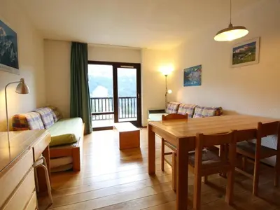 a living room with a table and a couch at Studio pour 5 personnes avec balcon, proche des pistes et commerces - Résidence Andromède, Flaine Forêt - FR-1-687-93 in Arâches-la-Frasse