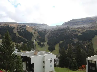 a view of a building and a valley with trees at Studio pour 5 personnes avec balcon, proche des pistes et commerces - Résidence Andromède, Flaine Forêt - FR-1-687-93 in Arâches-la-Frasse