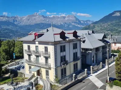 an aerial view of a building with mountains in the background at Nid douillet proche des pistes avec vue montagne in Saint-Gervais-les-Bains