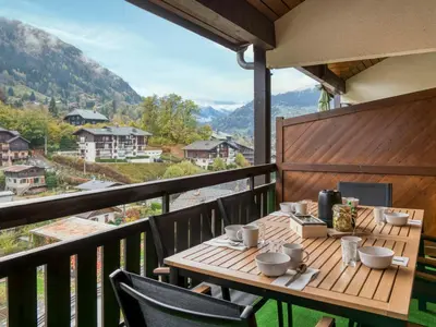 a dining room with a table and chairs at Triplex chaleureux avec wifi - 6 personnes - Proche centre - FR-1-663-6 in Saint-Gervais-les-Bains