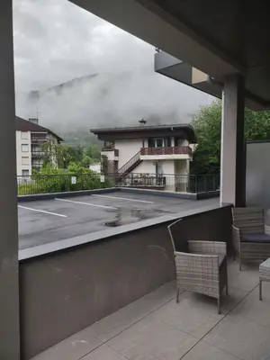 a view of a building from a balcony with chairs at Roomy studio near town and ski lift, free WiFi and parking in Saint-Gervais-les-Bains