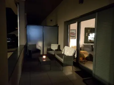 a living room with a couch and chairs and a table at Roomy studio near town and ski lift, free WiFi and parking in Saint-Gervais-les-Bains