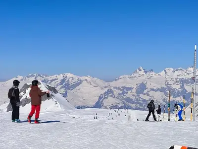 a group of people standing on a snow covered ski slope at Coquet Studio de 4 personnes aux Carroz - Balcon et Wifi in Les Carroz d'Araches