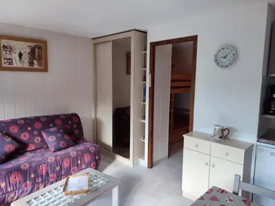 a living room with a couch and a table at Coquet Studio de 4 personnes aux Carroz - Balcon et Wifi in Les Carroz d'Araches