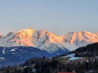 a view of a mountain range with snow covered mountains at Chalet à Cordon face à la chaîne du Mont Blanc in Cordon