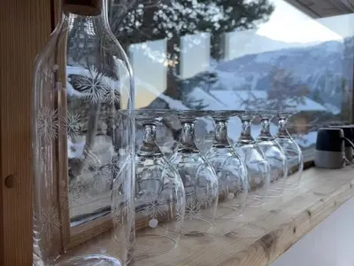 a row of wine glasses sitting on a shelf at Chalet indépendant 8 pers, déco moderne, proche centre et remontées, terrasse sud-ouest - FR-1-572-32 in Arâches-la-Frasse