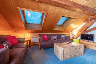 a hallway with stairs and a dog picture on the wall at Chalet La Chapelle aux pieds des pistes in Chamonix-Mont-Blanc