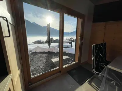 a room with a window with a view of the mountains at Gîte Au Balcon de Passy/Plaine Joux, classé 2 ** in Passy
