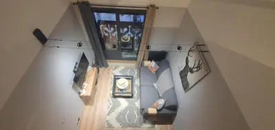 an overhead view of a living room with a couch at Duplex Aiguille du midi CHAMONIX in Chamonix-Mont-Blanc