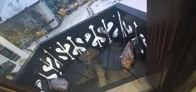an overhead view of a table and chairs with graffiti on it at Duplex Aiguille du midi CHAMONIX in Chamonix-Mont-Blanc