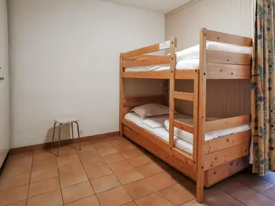 a bedroom with two bunk beds in a room at Sun Valley 3 - Vue Mont-Blanc in Chamonix-Mont-Blanc